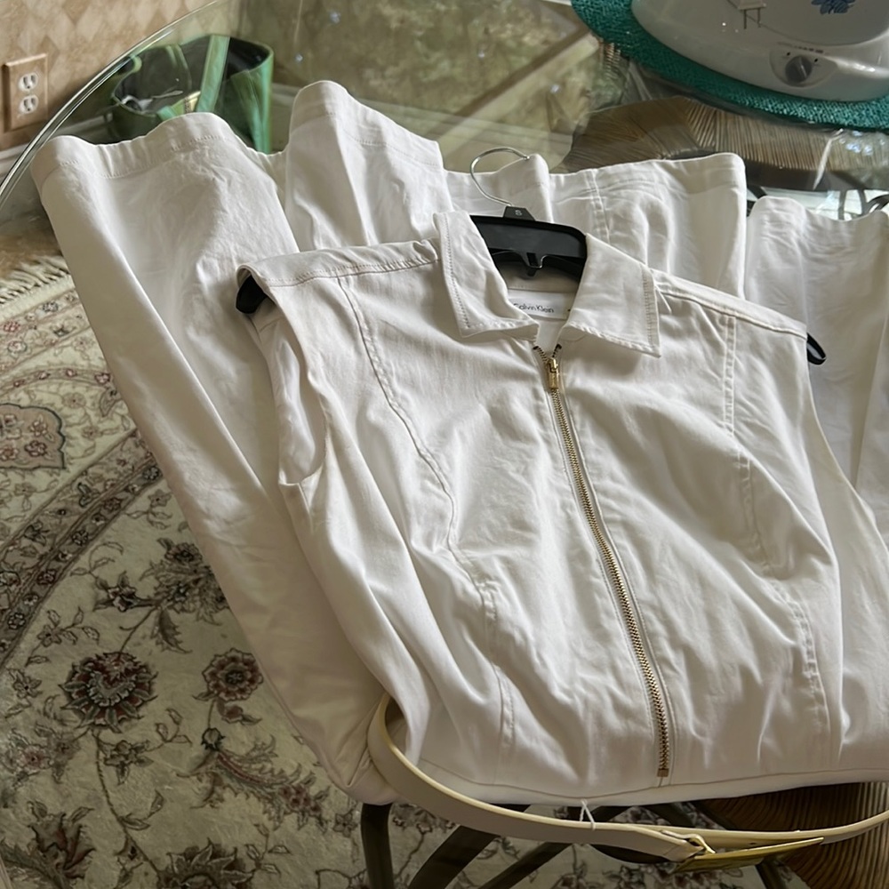 White sleeveless dress with belt, gold buckle